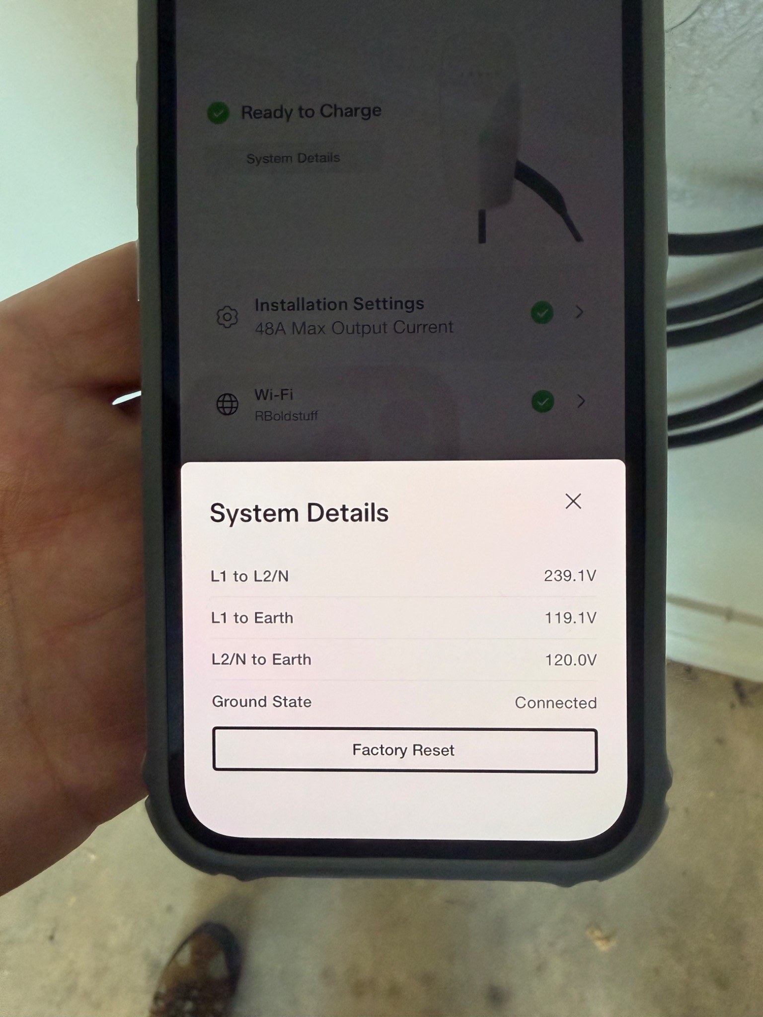 Tesla charging system commissioning details showing electrical readings